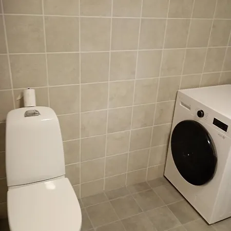 комната в апартаментах с террасой и барбекю в саду Quarto em Acomodações Particulares
